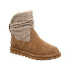 The BEARPAW Virginia Boots for women feature a tan suede design, flat sole, chunky wool knit shaft with upper cuff, and cozy white fleece lining for added warmth.
