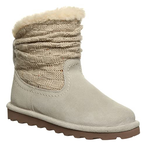 The BEARPAW Virginia Boots for women feature a light beige sheepskin design, wool knit shaft, faux fur lining, and a flat brown sole for warmth and comfort.