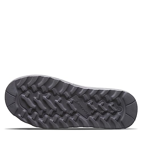 Close-up of a dark gray rubber sole with rugged, wavy tread for traction on the BEARPAW Shorty Boots - Womens.