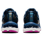 Rear view of ASICS Gel Nimbus 23 - Womens shoes in blue, featuring white midsoles, purple outsoles, visible brand logo on the heel, and advanced shock absorption technology.