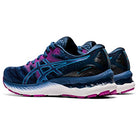The ASICS Gel Nimbus 23 Womens running shoes feature blue and pink uppers, white and pink soles, the ASICS logo on the side, and a cushioned heel for improved shock absorption.