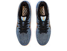 Top view of ASICS Gel Cumulus 24 - Mens shoes with black laces, honeycomb pattern insoles, orange midsole accents, and FF BLAST cushioning, displayed on a white background.