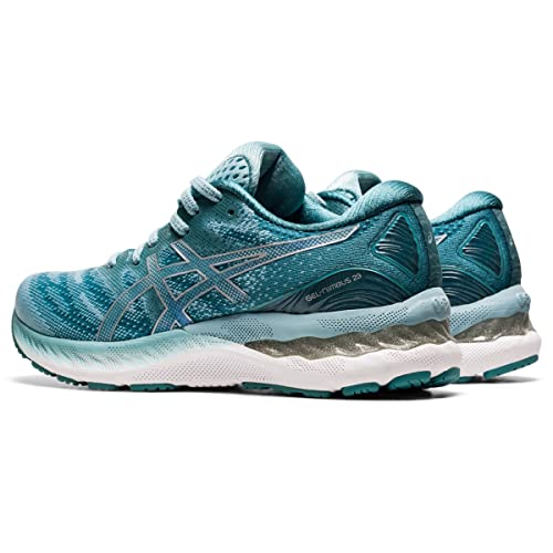 A pair of ASICS Gel Nimbus 23 - Womens running shoes in teal with silver accents, mesh uppers, white midsoles, and teal outsoles are shown side by side at a slight angle for superior shock absorption.