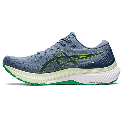 The ASICS Gel Kayano 29 - Mens running shoe features a blue mesh upper with green and yellow accents, a thick white midsole for stability, and a green-and-white outsole, shown in side profile.