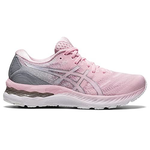 The ASICS Gel Nimbus 23 - Womens features a pink and gray mesh upper, white sole, lace-up design, side ASICS logo, and advanced shock absorption for comfort.