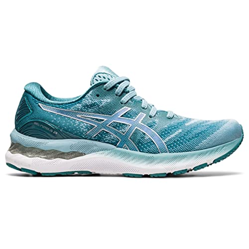 The ASICS Gel Nimbus 23 - Womenss is a teal running shoe with white accents, a mesh upper, cushioned sole for shock absorption, and the ASICS logo on the side. Shown from the side on a white background.
