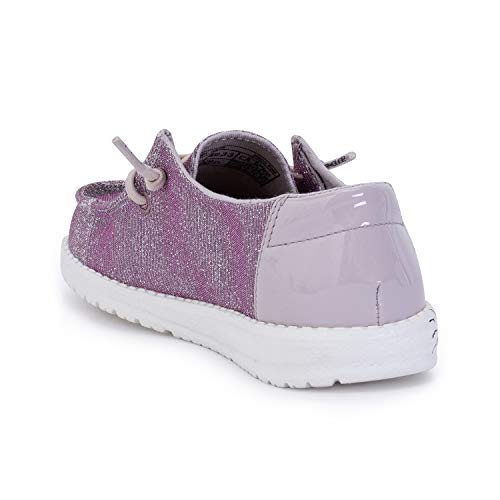 The Hey Dude Wendy Youth - Girls is a sparkly pink shoe with a shiny light purple heel, white sole, and side laces, shown from the back left—ideal for anyone seeking cute and lightweight footwear.