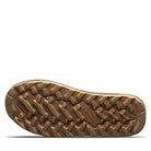 The image shows the bottom view of BEARPAW Tamara Boots - Womens, featuring a brown sole with rugged, textured treads for traction. Vibram is embossed in the center, with a white background highlighting the detail.