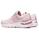 A pair of ASICS Cumulus 23 - Womens running shoes in light pink with white soles, subtle purple accents, and lightweight cushioning, displayed side by side facing slightly left.
