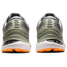 Rear view of the ASICS Gel Kayano 28 - Mens stability running shoes, showing gray-green uppers, orange accents on the soles, white midsoles with GEL technology, and detailed heel and tread design.