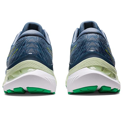 A pair of ASICS Gel Kayano 29 - Mens running shoes in blue, shown from the back with white soles featuring green treads and mesh uppers engineered for stability.