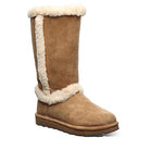 The BEARPAW Kendall Boots for women are tall tan winter boots with a flat sole and white shearling trim—perfect for cozying up après-ski at Lake Tahoe.