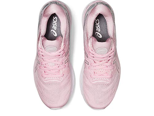 Top view of a pair of light pink ASICS Gel Nimbus 23 - Womens running shoes with laces, featuring the logo on the insoles and tongue. Known for excellent shock absorption, they provide long-distance comfort.