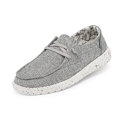 The Hey Dude Wendy Linen - Womens is a casual gray canvas low-top moc with light gray laces, a white speckled rubber sole, subtle inner lining, and a relaxed slip-on design for effortless everyday comfort.