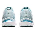 A pair of light blue ASICS Cumulus 23 - Womens running shoes are shown from the back, featuring white soles and blue accents, placed side by side on a white background to showcase their lightweight cushioning.
