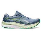 The mens ASICS Gel Kayano 29 is a blue and green running shoe with a white sole, lime green accents, the ASICS logo on the side, and is designed for stability and comfort.