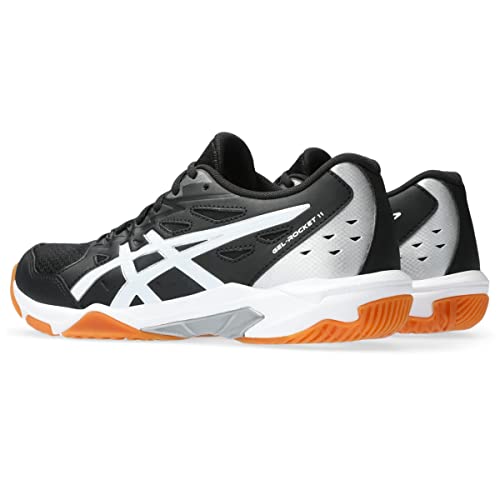 A pair of ASICS Gel-Rocket 11 - Womens indoor court shoes in black, white, and gray with orange soles are shown from side and rear angles on a white background, designed for stability and performance.