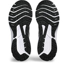 The image shows the soles of the ASICS GT-1000 12 - Mens shoe, featuring a black and white tread with grooves and textured sections for grip and flexibility—ideal for runners who overpronate.