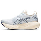 The ASICS Gel Nimbus 25 - Womens shoe features a light blue upper, thick off-white sole, dark blue accents, and prominent ASICS logo. The 25 near the heel highlights lightweight cushioning for ultimate comfort while running.