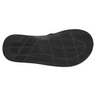 The image shows the black ChacoGrip rubber sole of the Chaco Classic Flip - Men, featuring a wavy, textured tread and the Chaco logo embossed near the center.