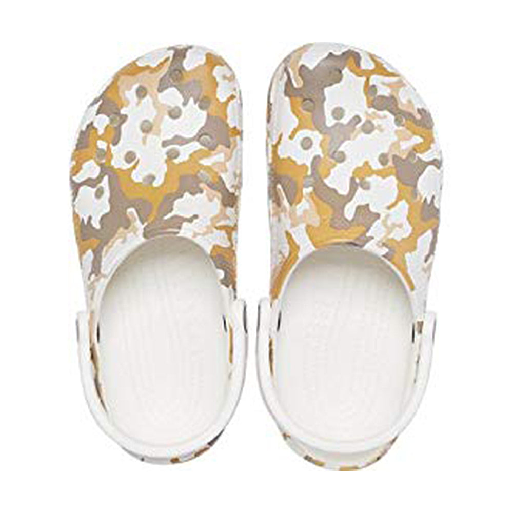 The Crocs Classic Camo Clog - Unisex features back straps and a tan, brown, and white camouflage pattern. Photographed from above on a white background.
