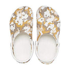 The Crocs Classic Camo Clog - Unisex features back straps and a tan, brown, and white camouflage pattern. Photographed from above on a white background.