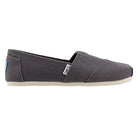 A side view of the TOMS Alpargata ESP - Women shows its gray slip-on canvas style, white sole, and small TOMS tag near the heel, highlighting the brands signature comfortable design.