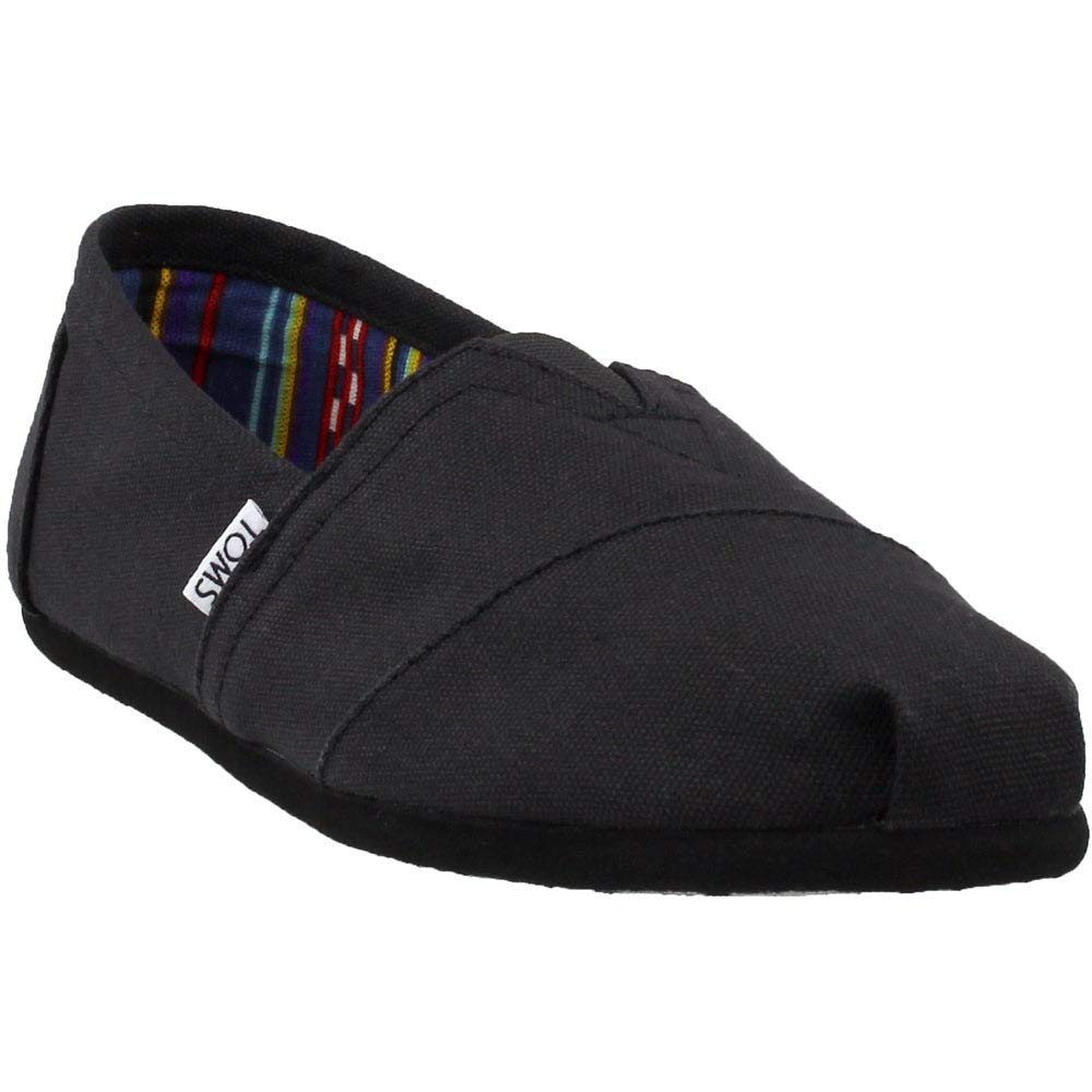 The TOMS Classic Canvas - Men is a black slip-on with a rounded toe and a small white side label. It features a colorful striped inner lining for added style.