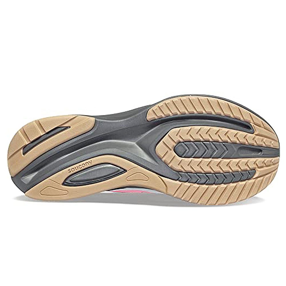 The image shows the sole of the Saucony Guide 16 Running Shoe - Womens, with tan, black, and gray rubber. Grooved patterns enhance traction and cushioning, while the Saucony logo is engraved on the sole.