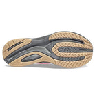 The image shows the sole of the Saucony Guide 16 Running Shoe - Womens, with tan, black, and gray rubber. Grooved patterns enhance traction and cushioning, while the Saucony logo is engraved on the sole.