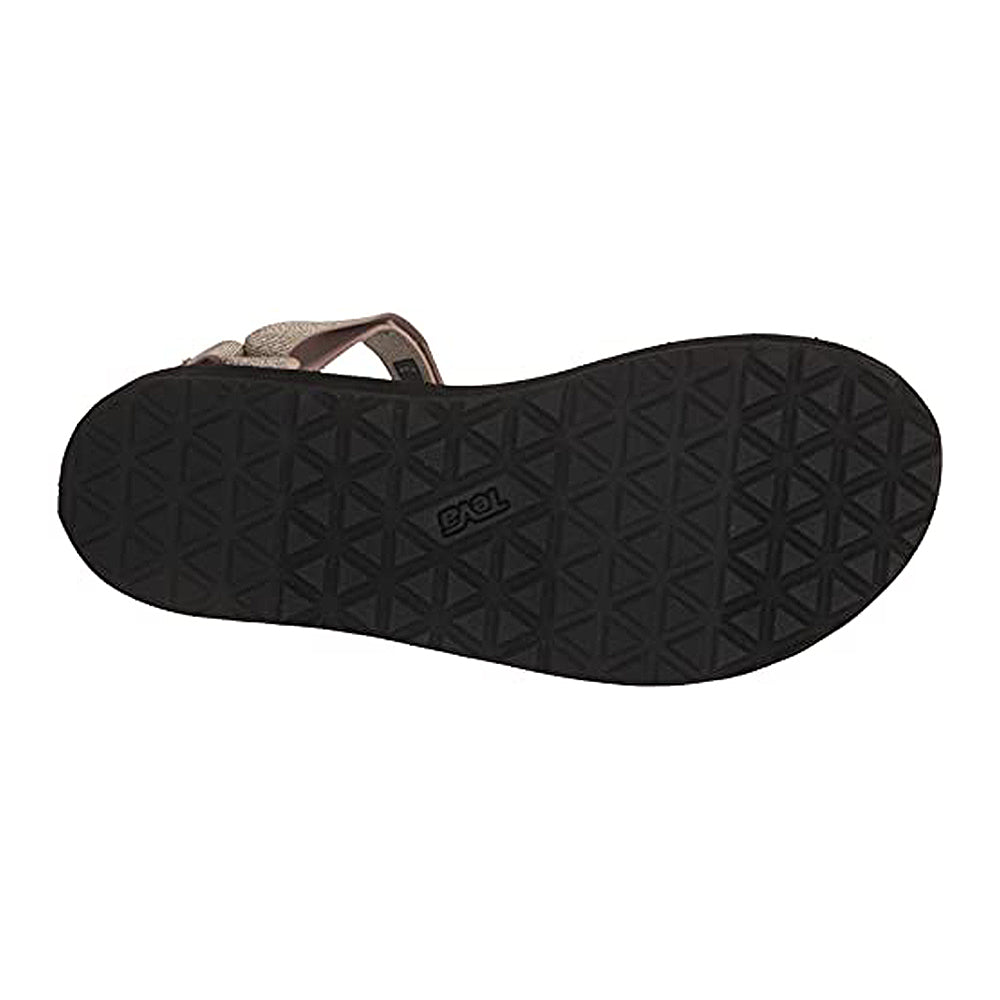 The image shows the bottom view of the Teva Midform Universal - Womens sandal, featuring a black sole with a geometric triangle pattern and the Teva logo embossed at the center.