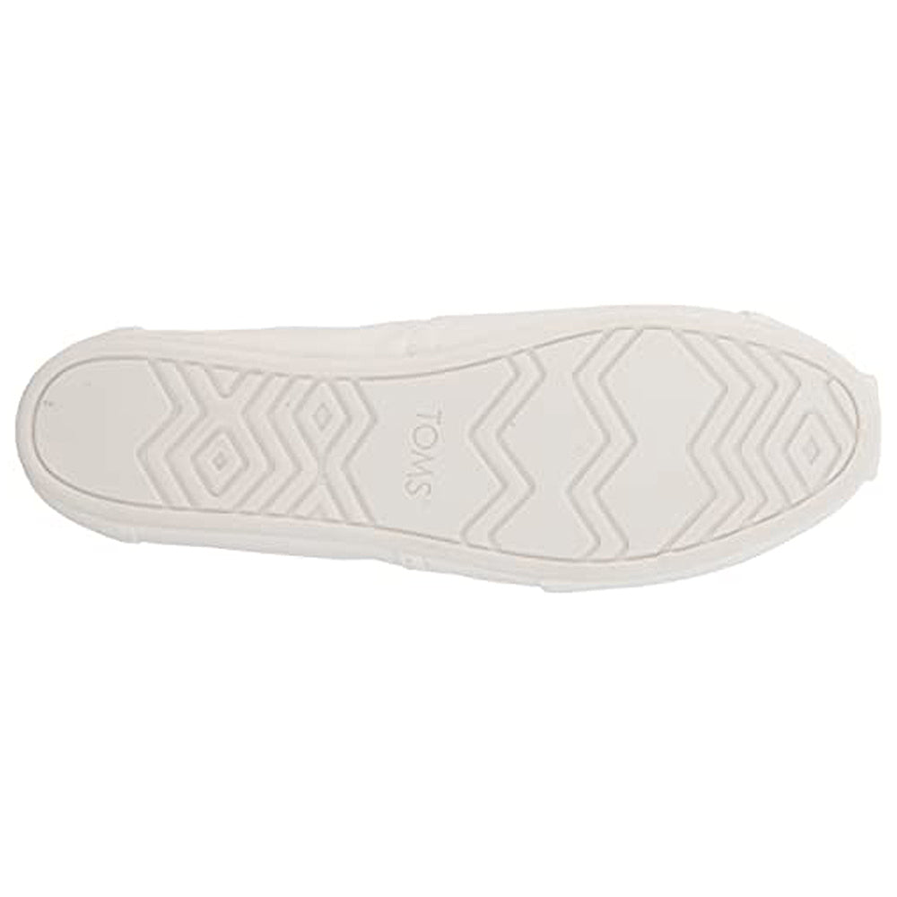 A white sole with zigzag and diamond tread patterns, inspired by the Alpargata—Womens, features the TOMS brand name at its center.