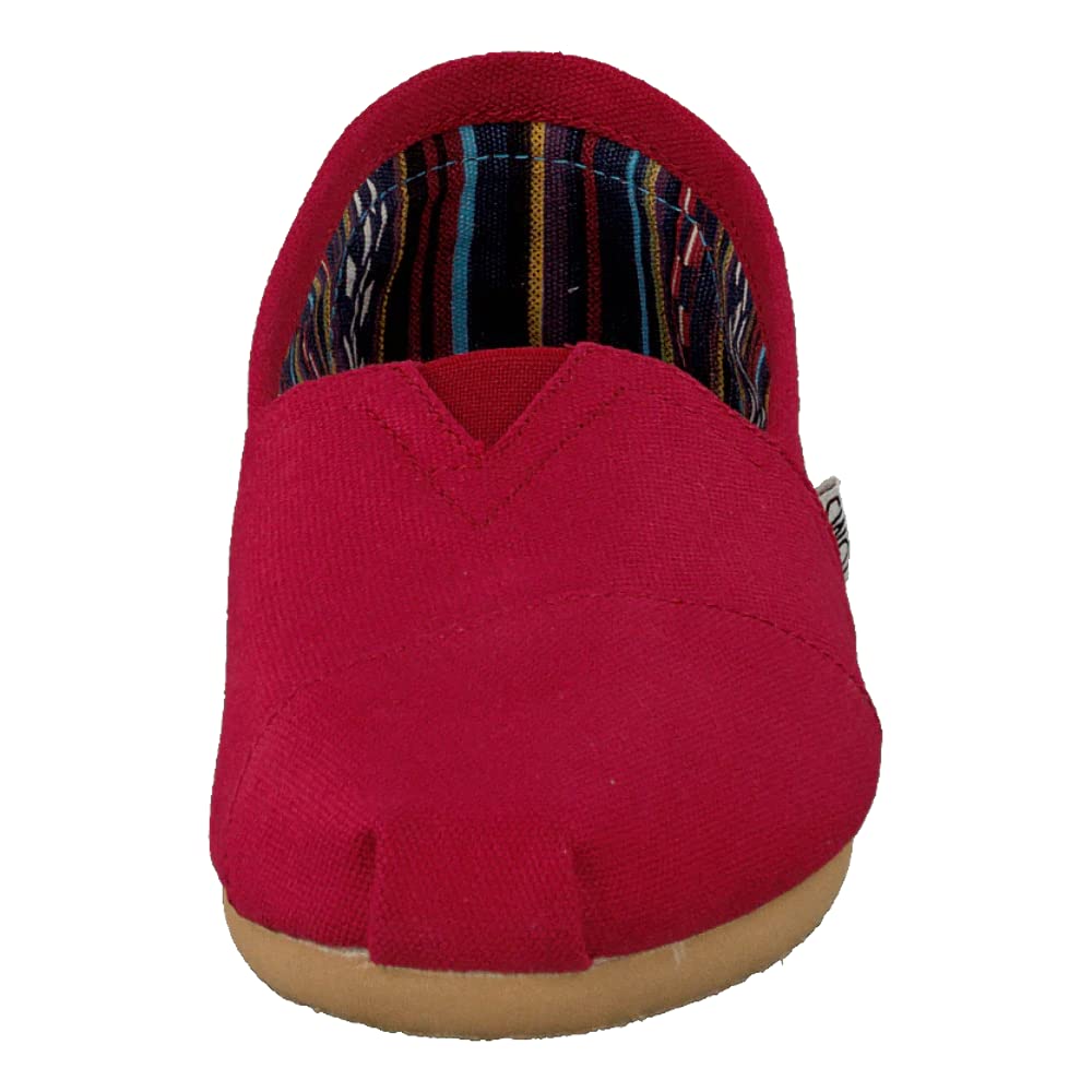 Front view of the TOMS Alpargata ESP - Women: a red slip-on canvas shoe with a tan rubber sole and multicolored striped lining, featuring the brands classic design and supporting their buy one give one movement.