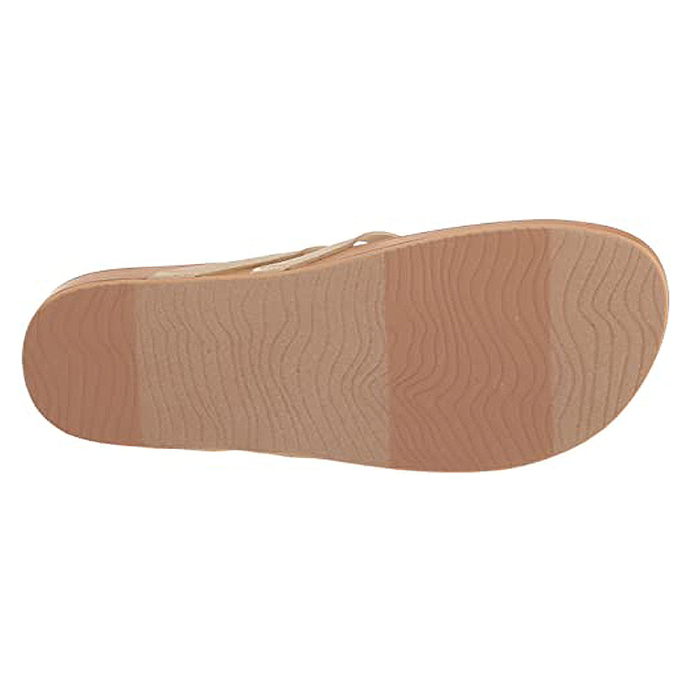 The image displays the bottom view of the Reef Cushion Spring Joy - Womens sandal in beige, featuring a textured wavy tread and a sole with three subtle color blocks that transition from light to slightly darker beige.