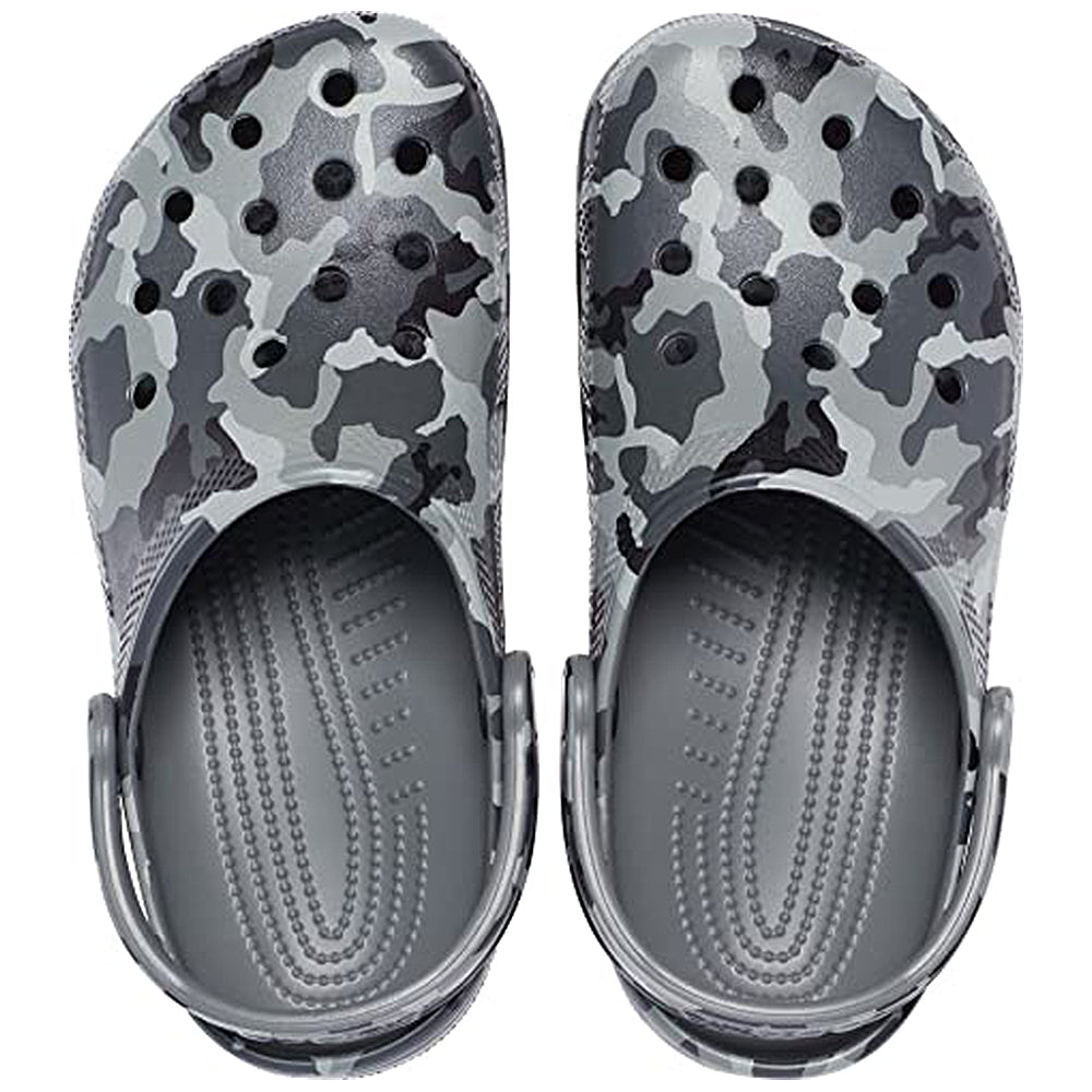 The Crocs Classic Camo Clog - Unisex features a black and white camouflage pattern, ventilation holes, adjustable heel straps, and offers comfortable slip-on water shoe convenience.