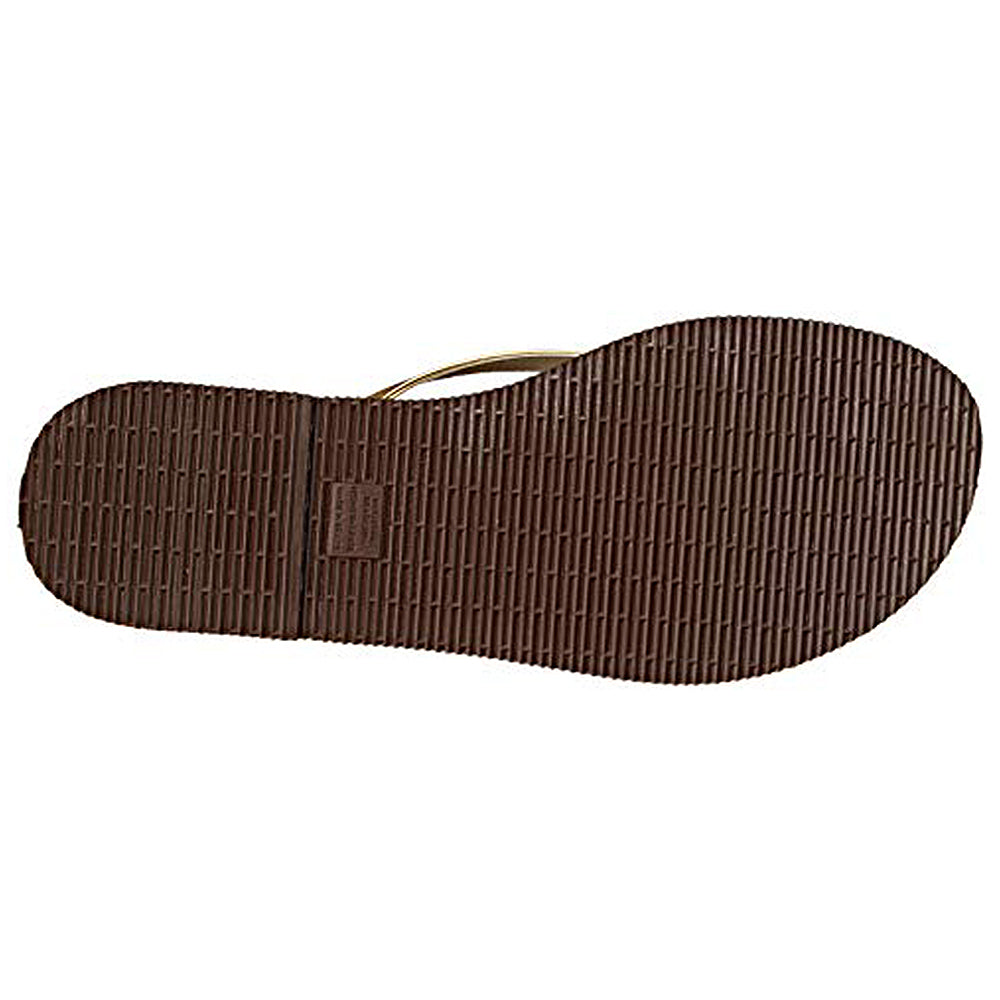 The image displays the bottom view of the Havaianas Slim Metalic - Womens sandal, featuring a textured rubber sole with a grid-like tread pattern made of horizontal and vertical lines, characteristic of classic Havaianas designs.