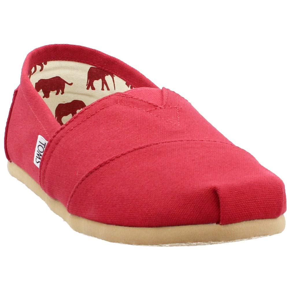 The TOMS Classic Canvas - Men is a red slip-on shoe with a beige sole, white side label, and an inner lining featuring red animal silhouettes.