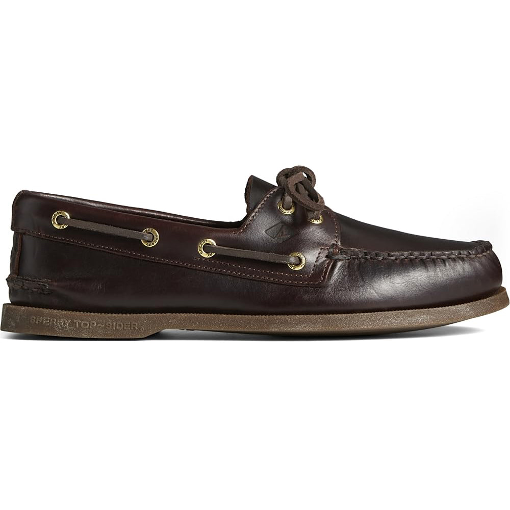 The Sperry A/O 2-EYE LEATHER mens boat shoe features classic white stitching, gold eyelets, leather laces, and a flat rubber sole in a timeless side profile.