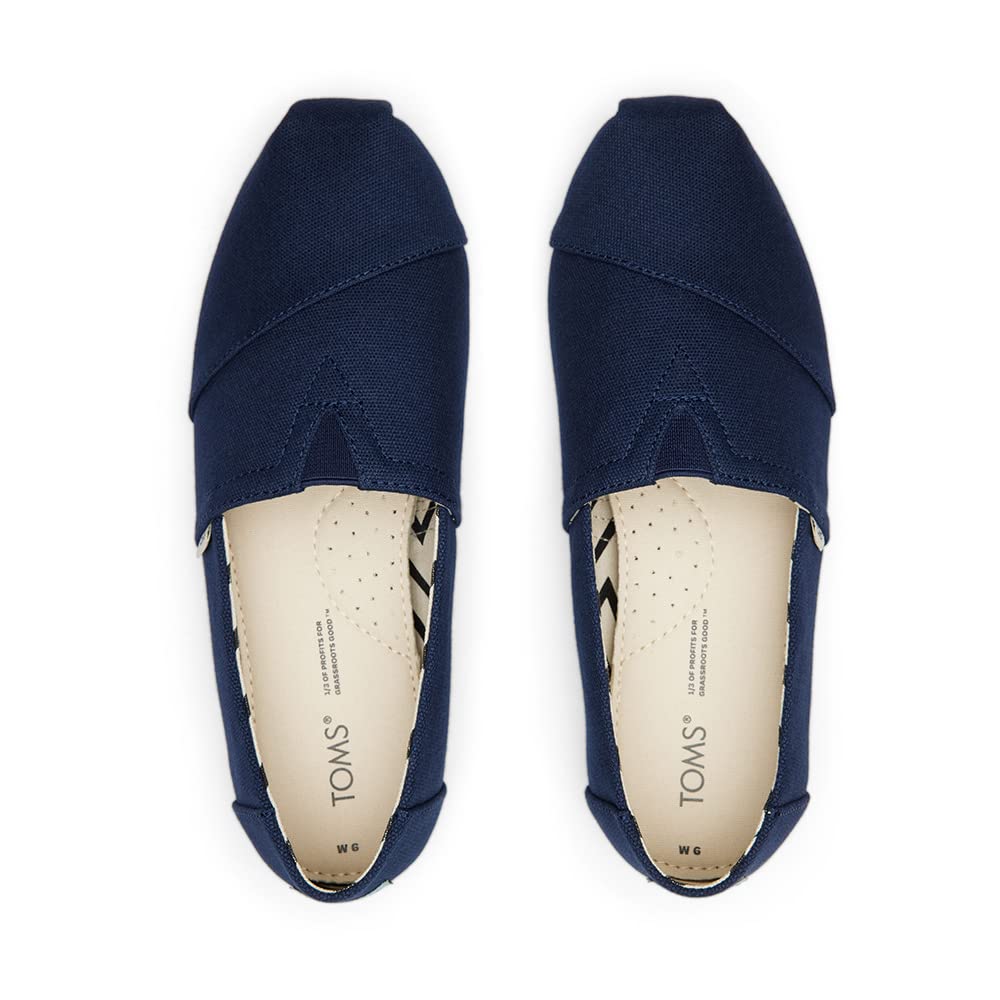 A top view of TOMS Alpargata - Womens shoes in navy blue, made with recycled cotton canvas and featuring branded, light-colored insoles with perforations for breathability.