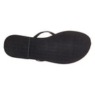 The image shows the bottom view of a black Havaianas Slim Metalic - Womens sandal with a textured rubber sole and a visible thin strap on one side.