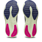 The image displays the soles of ASICS Gel Nimbus 25 - Womens, featuring navy blue, off-white, and bright pink sections with a textured, perforated design for grip and flexibility—perfect for lightweight cushioning in running shoes.
