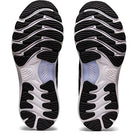 The ASICS Gel Nimbus 23 - Womens running shoe soles feature black and white wavy tread patterns, textured grooves for grip, clear midfoot sections, and enhanced shock absorption, as seen from below.