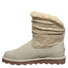The BEARPAW Virginia Boots for women feature a beige suede ankle design with a wool knit shaft, cream-colored fluffy lining, flat brown rubber sole, and slouchy style.