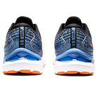 Two blue and black ASICS Gel Cumulus 24 - Mens running shoes are shown from the back, featuring orange and white soles, the ASICS logo, a textured upper, and FF BLAST cushioning for everyday comfort.