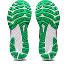 A pair of ASICS Gel Kayano 29 – Mens running shoe soles in green and white, with unique tread designs for stability, displayed side by side with toes facing upward.