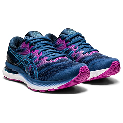 A pair of ASICS Gel Nimbus 23 - Womens running shoes in blue with pink and black accents, featuring excellent shock absorption, white and pink sole, and the ASICS logo on the side and tongue.