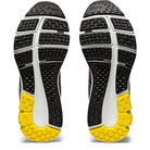 A pair of ASICS GEL-PULSE 12 - Womens running shoe soles, featuring black, white, and yellow tread (yellow at the toe), are shown side by side with a clear view of the bottoms.