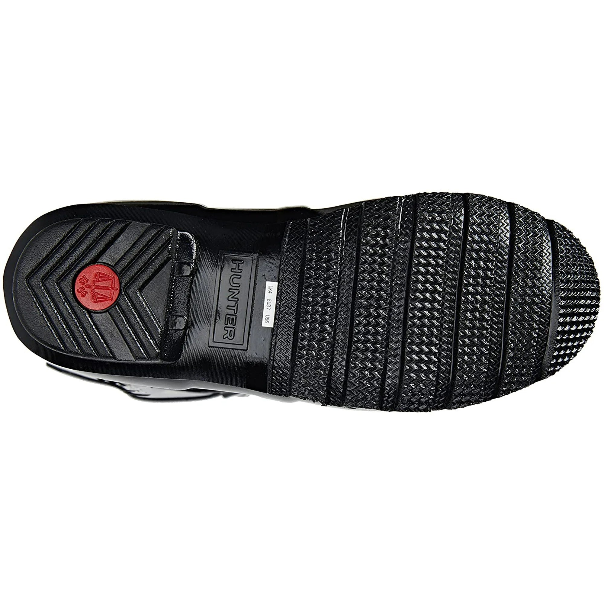 The image shows the sole of a womens Hunter Original Short Gloss Rain Boot in black, with textured grip patterns, a red circular logo near the heel, and HUNTER on a rectangular midsole label.