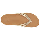 A top view of the Reef Cushion Spring Joy - Womens sandal in tan with metallic gold straps, featuring a cushioned footbed and minimalist design, ideal for womens flip flops.