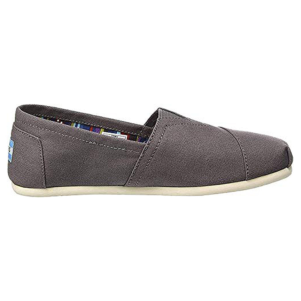 A side view of the TOMS Classic Canvas - Men alpargata in gray features a white sole, slip-on design, visible stitching, and a patterned inner lining.
